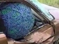 Huge Rubberband Ball Smashes a Car