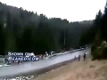 Rally car nails people watching the race